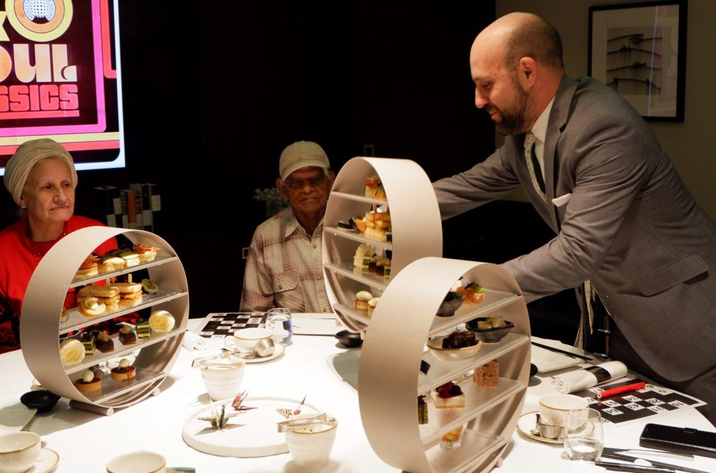 Afternoon Tea at Prince Akatoki Hotel Two guests sat at a table being served afternoon tea by a member of staff