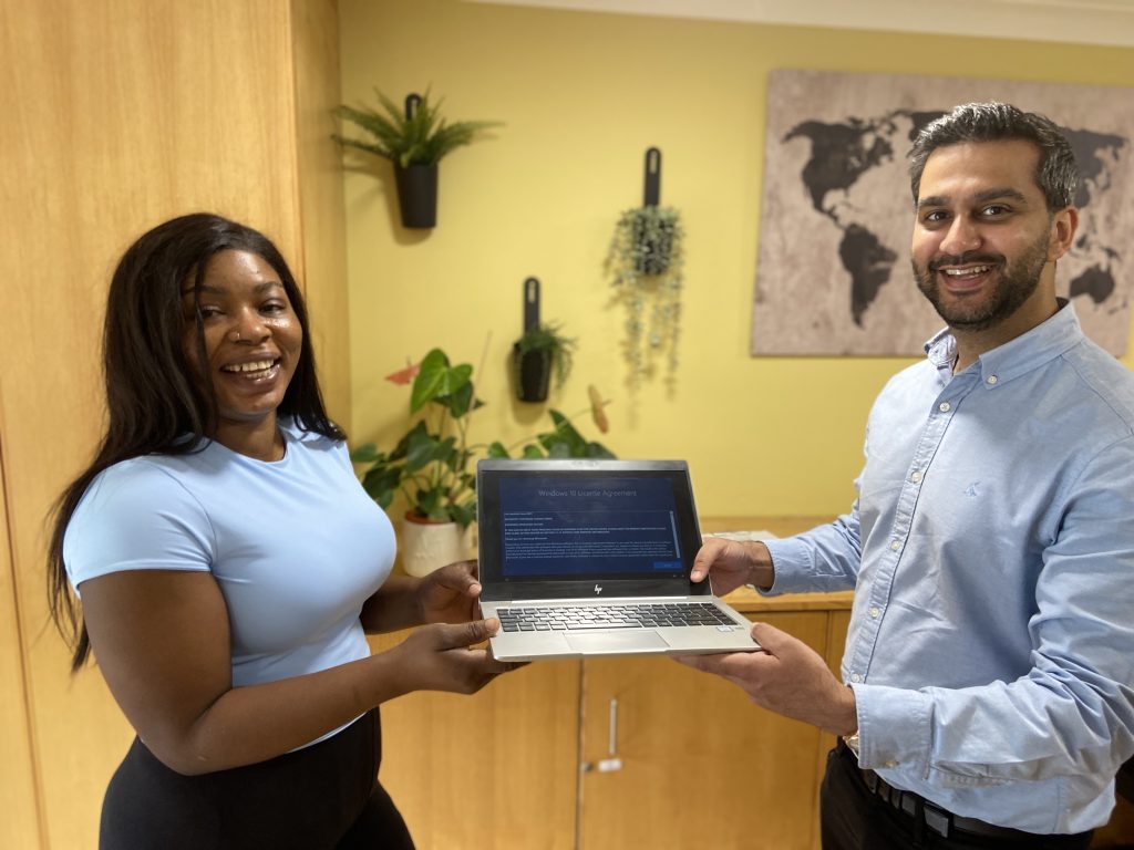 Penfold’s Activities Manager receives the five laptop donations from Hammerson.